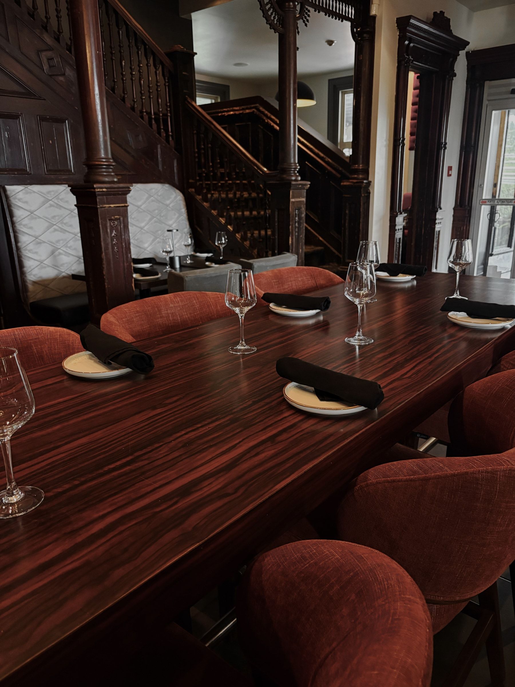 Large wooden table set for a group at Club Touriste, Salaberry-de-Valleyfield